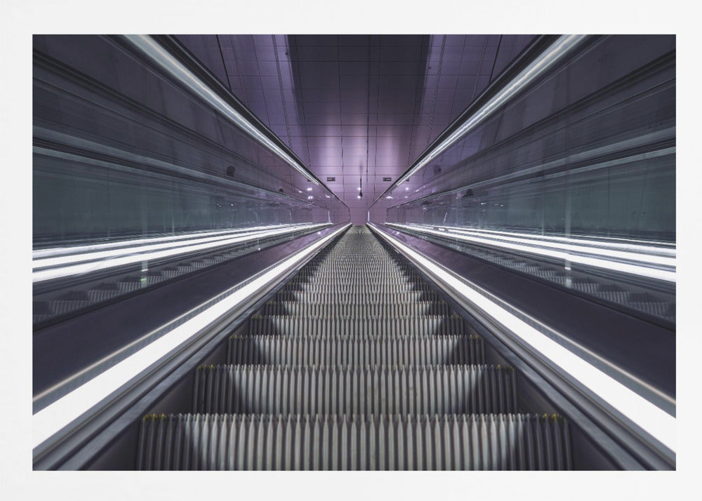 A symmetrical, first-person view looking down a long, empty escalator in a modern subway station, with bright white lights lining the handrails and a purple glow on the ceiling, creating a futuristic and infinite perspective. Wall Art