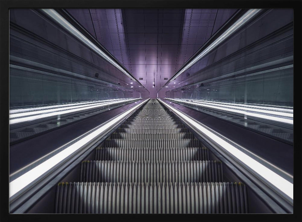 A symmetrical, first-person view looking down a long, empty escalator in a modern subway station, with bright white lights lining the handrails and a purple glow on the ceiling, creating a futuristic and infinite perspective. Wall Art