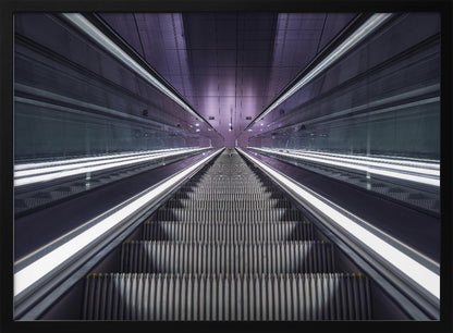 A symmetrical, first-person view looking down a long, empty escalator in a modern subway station, with bright white lights lining the handrails and a purple glow on the ceiling, creating a futuristic and infinite perspective. Wall Art