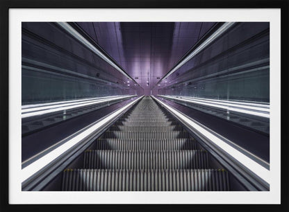 A symmetrical, first-person view looking down a long, empty escalator in a modern subway station, with bright white lights lining the handrails and a purple glow on the ceiling, creating a futuristic and infinite perspective. Wall Art