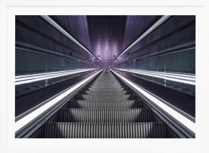 A symmetrical, first-person view looking down a long, empty escalator in a modern subway station, with bright white lights lining the handrails and a purple glow on the ceiling, creating a futuristic and infinite perspective. Wall Art