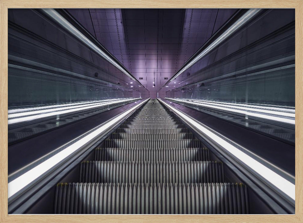A symmetrical, first-person view looking down a long, empty escalator in a modern subway station, with bright white lights lining the handrails and a purple glow on the ceiling, creating a futuristic and infinite perspective. Wall Art