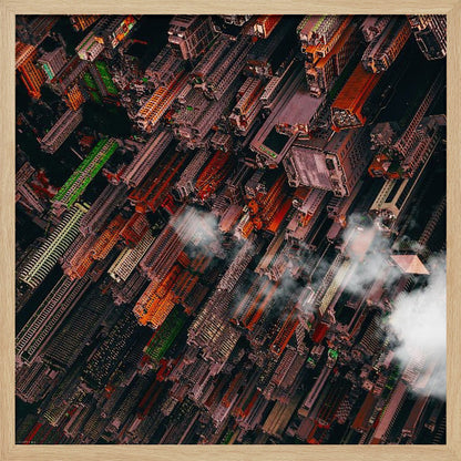 A dramatic, high-angle aerial photograph looking straight down into a super-dense, futuristic cityscape with towering skyscrapers packed together, featuring pops of orange and green among the dark buildings. Wisps of clouds float between the towers, and the image is presented in a light wood frame. Print