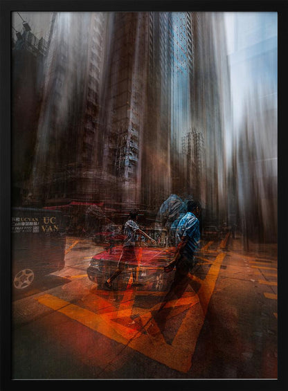 An abstract, vertically oriented photograph of a city street with a strong motion blur effect. Towering buildings are stretched vertically, creating a surreal, melting appearance. In the foreground, semi-transparent figures of people cross a street with bright orange markings, near a red car, suggesting a chaotic and energetic urban scene. Artwork