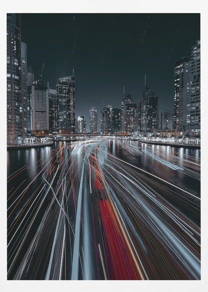 A dynamic long-exposure photograph of a bustling city marina at night. In the foreground, vibrant streaks of red and white light from moving boats cut across the dark water. In the background, a modern skyline of illuminated skyscrapers stands against a dark night sky, creating a futuristic and energetic scene. Poster