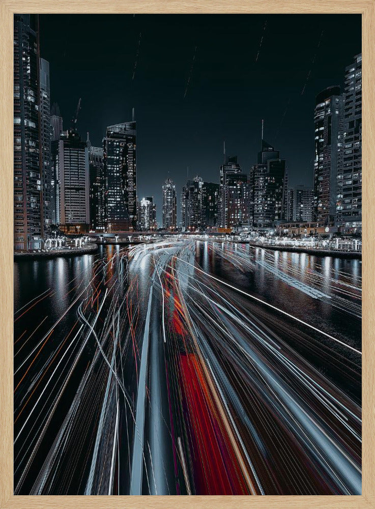 A dynamic long-exposure photograph of a bustling city marina at night. In the foreground, vibrant streaks of red and white light from moving boats cut across the dark water. In the background, a modern skyline of illuminated skyscrapers stands against a dark night sky, creating a futuristic and energetic scene. Poster