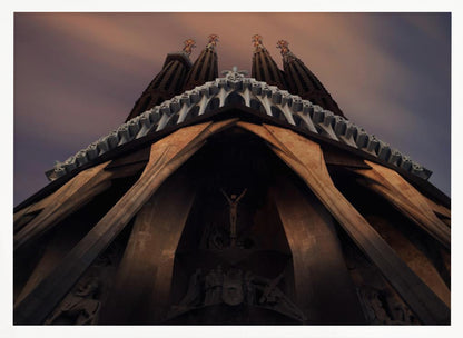 A dramatic, low-angle shot of the Sagrada Familia cathedral, focusing on the intricate details of the Passion Facade against a dusky purple and orange sky. The spires tower above, while deep shadows highlight the unique, angled columns and the central sculpture of the crucifixion. Poster