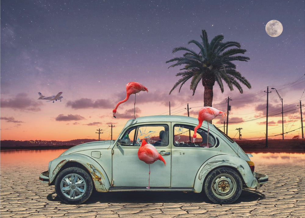 A surreal digital art piece featuring a vintage light blue Volkswagen Beetle abandoned on a cracked desert floor. Three vibrant pink flamingos are interacting with the car, which has shattered windows. The background shows a dramatic transition from an orange sunset over water to a deep purple, star-filled night sky with a large full moon and a distant airplane. Decor