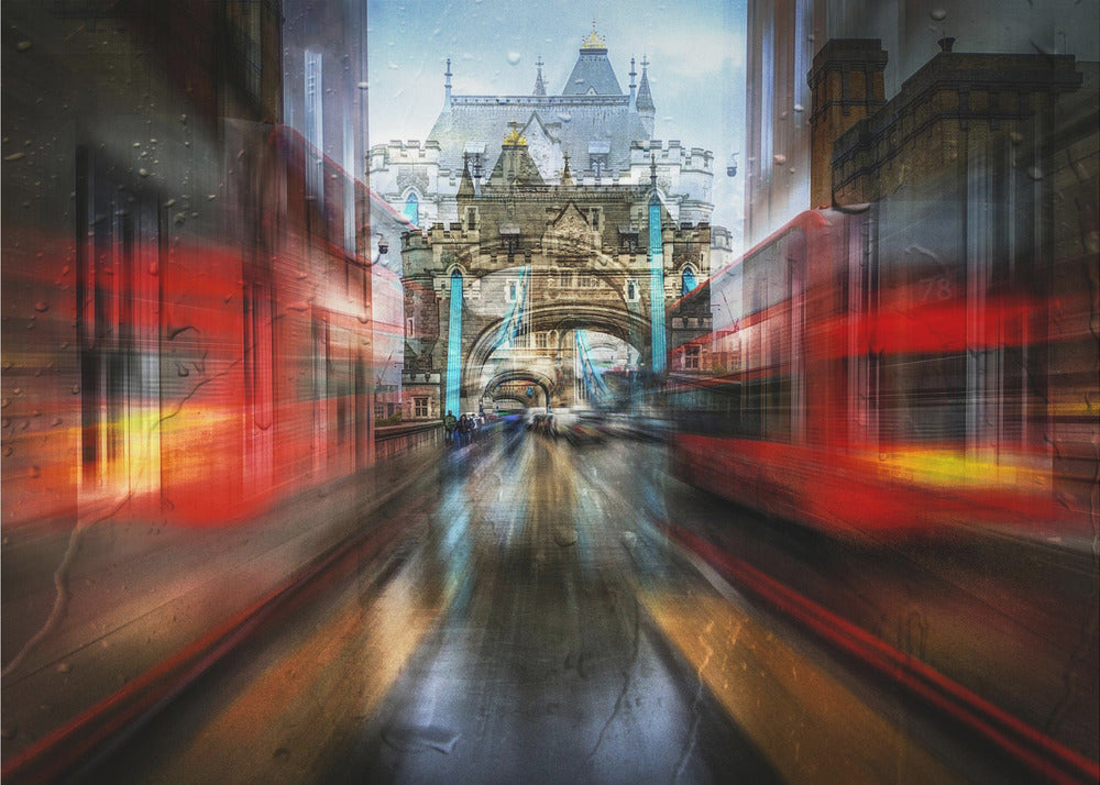 An abstract, motion-blurred digital art piece depicting a view of London's Tower Bridge down a wet street, framed by the red streaks of passing double-decker buses, creating a dynamic and rainy city atmosphere, all enclosed in a silver frame. Poster