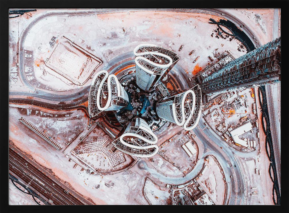 A dizzying top-down aerial photograph of five futuristic, petal-shaped skyscrapers surrounding a central turquoise pool. The surrounding urban landscape is a mix of dusty pink construction sites and curving roads, creating a surreal and abstract cityscape. Wall Art