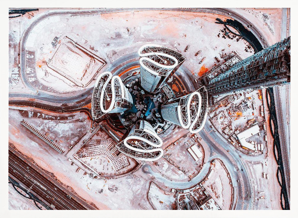 A dizzying top-down aerial photograph of five futuristic, petal-shaped skyscrapers surrounding a central turquoise pool. The surrounding urban landscape is a mix of dusty pink construction sites and curving roads, creating a surreal and abstract cityscape. Wall Art