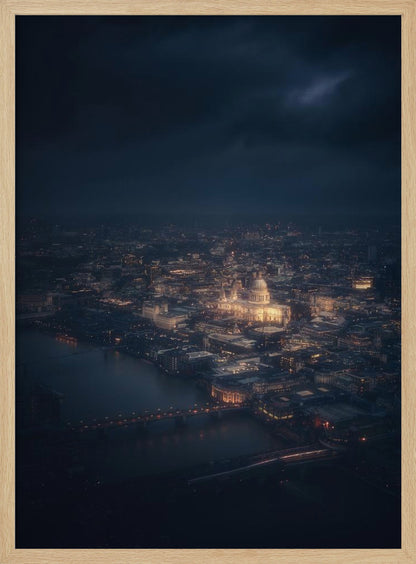 An atmospheric aerial view of London at night, with the illuminated St. Paul's Cathedral as the central focus. The sprawling cityscape glows with warm lights against a dark, stormy sky, while the River Thames flows in the foreground. Wall Art