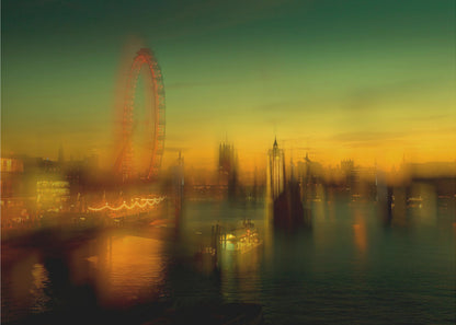 A dreamlike, blurred photograph of the London skyline at dusk, with the glowing orange London Eye on the left and the hazy silhouette of the Houses of Parliament across the River Thames. The sky shifts from a deep green to a warm golden yellow, and the city's lights cast shimmering reflections on the water. Decor