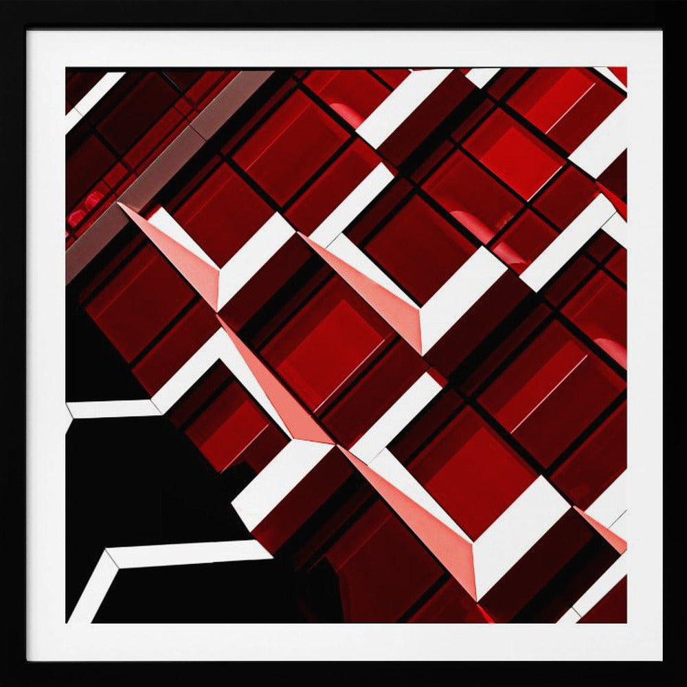 A close-up, angular photograph of a modern building's facade, framed in light wood. The composition is a dynamic geometric pattern of glossy red square panels, stark white lines, and deep black shadows, creating a sense of depth and abstract complexity. Wall Art