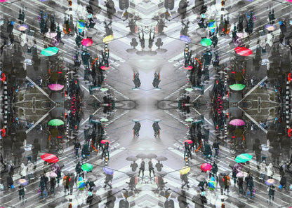 A symmetrical, kaleidoscopic abstract artwork created from an aerial view of a rainy city intersection. The mostly black and white image features pops of vibrant color from numerous umbrellas held by pedestrians crossing the street, all framed in a textured silver border. Artwork