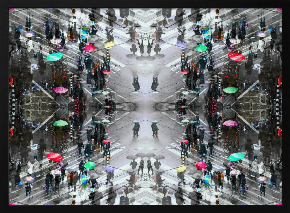 A symmetrical, kaleidoscopic abstract artwork created from an aerial view of a rainy city intersection. The mostly black and white image features pops of vibrant color from numerous umbrellas held by pedestrians crossing the street, all framed in a textured silver border. Artwork