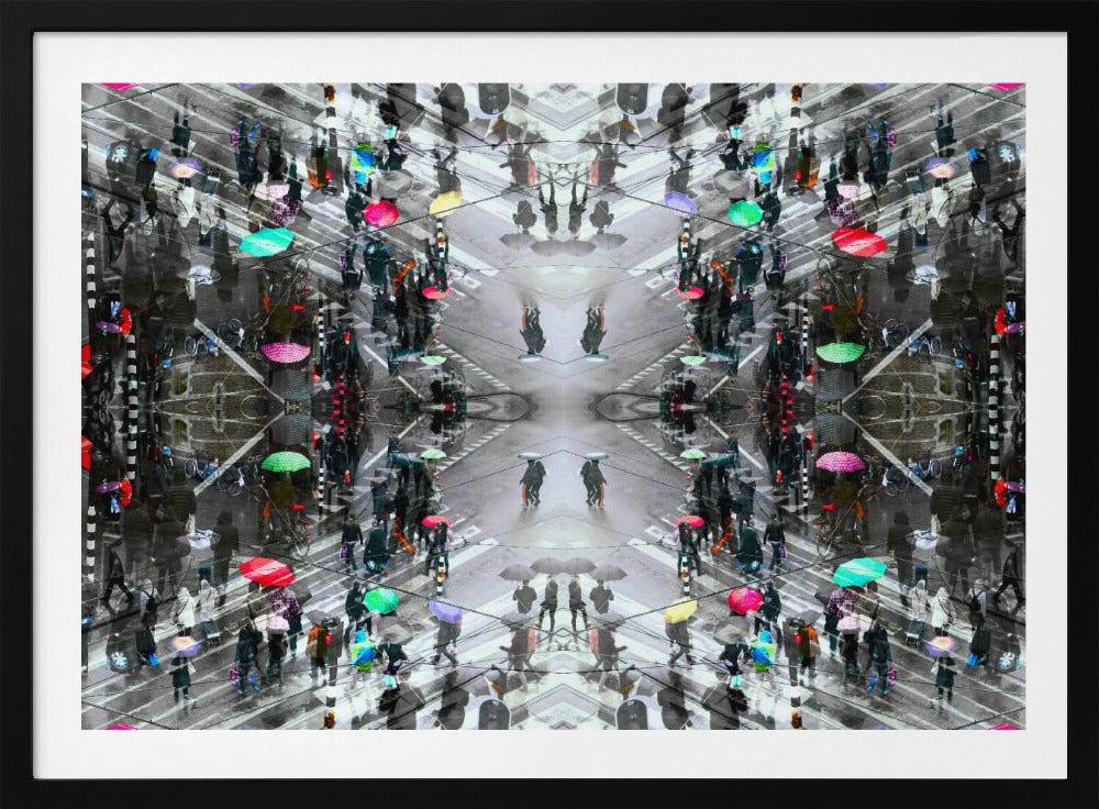 A symmetrical, kaleidoscopic abstract artwork created from an aerial view of a rainy city intersection. The mostly black and white image features pops of vibrant color from numerous umbrellas held by pedestrians crossing the street, all framed in a textured silver border. Artwork