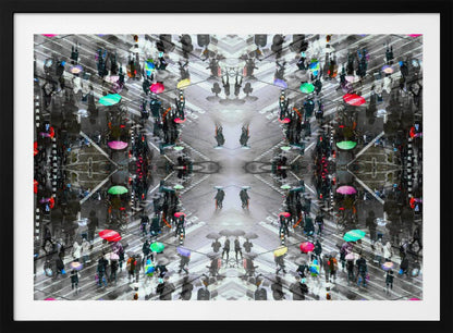 A symmetrical, kaleidoscopic abstract artwork created from an aerial view of a rainy city intersection. The mostly black and white image features pops of vibrant color from numerous umbrellas held by pedestrians crossing the street, all framed in a textured silver border. Artwork