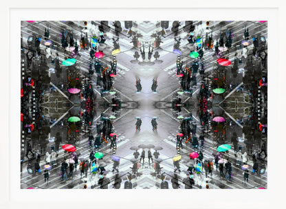 A symmetrical, kaleidoscopic abstract artwork created from an aerial view of a rainy city intersection. The mostly black and white image features pops of vibrant color from numerous umbrellas held by pedestrians crossing the street, all framed in a textured silver border. Artwork