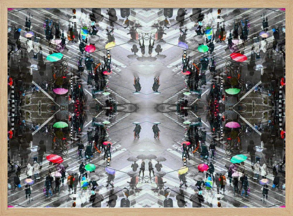 A symmetrical, kaleidoscopic abstract artwork created from an aerial view of a rainy city intersection. The mostly black and white image features pops of vibrant color from numerous umbrellas held by pedestrians crossing the street, all framed in a textured silver border. Artwork