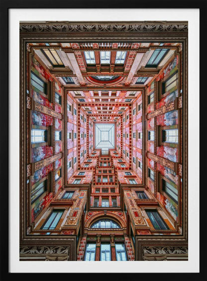A symmetrical, worm's-eye view looking up through the center of an ornate, multi-story courtyard. The red and gold walls are covered in intricate details and frescoes, receding into the distance towards a square glass skylight. The entire artwork is presented within a decorative dark brown frame. Artwork