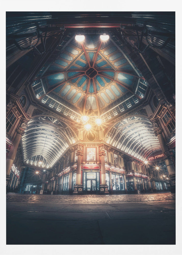A dramatic, low-angle, wide shot of an empty Leadenhall Market at night. The ornate, domed ceiling is illuminated in blue and gold by bright, warm lights, which also cast a glow on the cobblestone floor and detailed Victorian storefronts. Wall Art