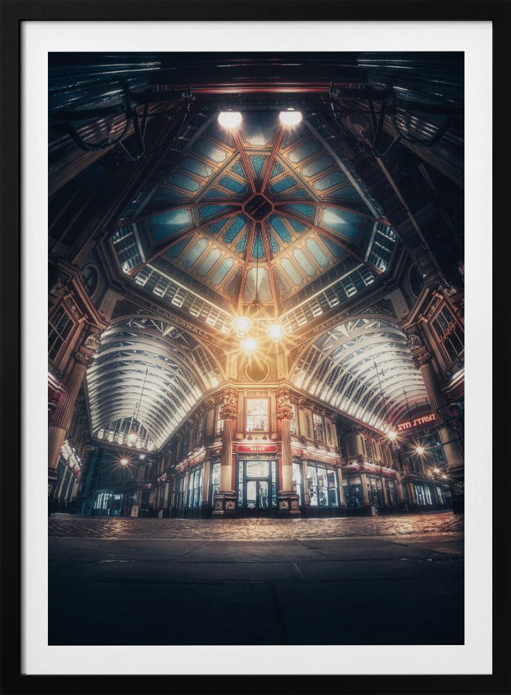 A dramatic, low-angle, wide shot of an empty Leadenhall Market at night. The ornate, domed ceiling is illuminated in blue and gold by bright, warm lights, which also cast a glow on the cobblestone floor and detailed Victorian storefronts. Wall Art