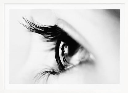 A dramatic black and white macro photograph of a human eye in profile, with a surreal reflection of a person's silhouette visible in the pupil. Print