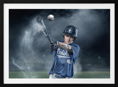 A dramatic, framed portrait of a young baseball player in a blue jersey and helmet, captured in the moment of hitting a baseball, with a cloud of dust exploding from the bat against a dark, smoky background. Poster