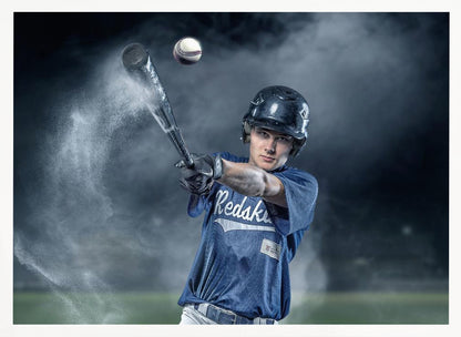 A dramatic, framed portrait of a young baseball player in a blue jersey and helmet, captured in the moment of hitting a baseball, with a cloud of dust exploding from the bat against a dark, smoky background. Poster