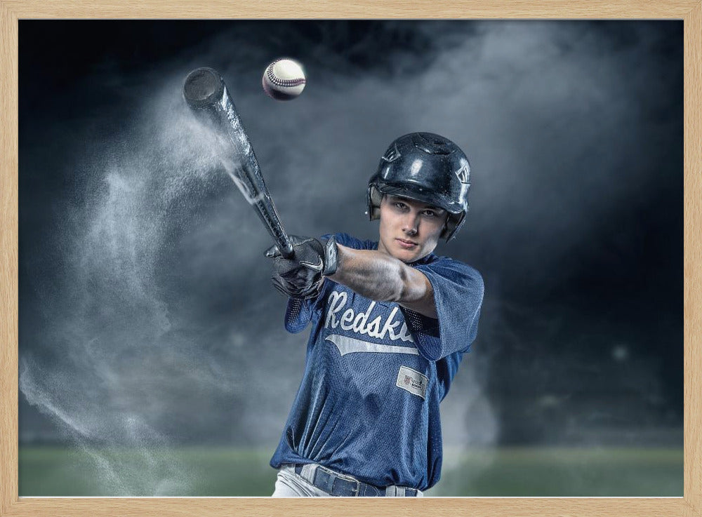 A dramatic, framed portrait of a young baseball player in a blue jersey and helmet, captured in the moment of hitting a baseball, with a cloud of dust exploding from the bat against a dark, smoky background. Poster