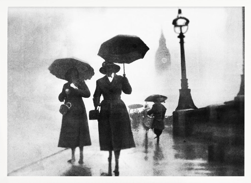 A vintage black and white photograph of people with umbrellas walking on a wet, foggy day in London. The silhouettes of the people are dark against the misty background, where the faint outline of Big Ben and a street lamp are visible. Wall Art