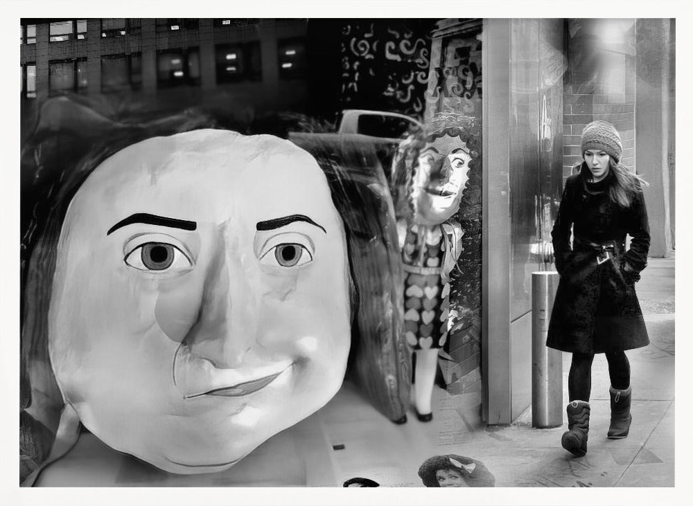 A surreal black and white photograph with a silver frame, featuring a giant, cartoonish head of a historical figure reflected in a window, juxtaposed with a young woman in a winter coat and beanie walking down a city sidewalk. Wall Art