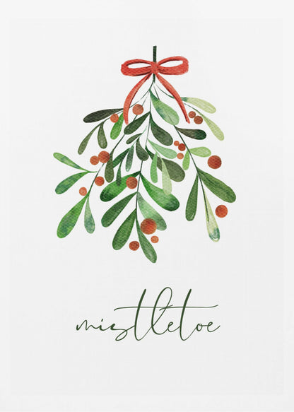 A framed watercolor illustration of a sprig of mistletoe with green leaves and red berries, tied with a red bow. Below the plant, the word 'mistletoe' is written in a cursive script on a clean white background. Artwork