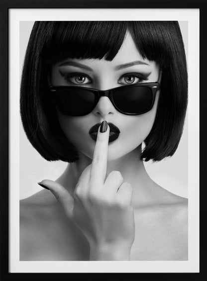 A striking black and white portrait of a woman with a sharp bob haircut, sunglasses, and bold makeup. She holds one finger with a black-painted nail up to her dark lips, making a 'shushing' gesture. Poster