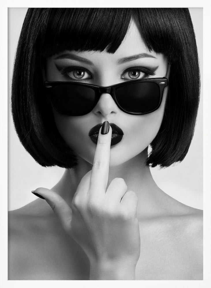 A striking black and white portrait of a woman with a sharp bob haircut, sunglasses, and bold makeup. She holds one finger with a black-painted nail up to her dark lips, making a 'shushing' gesture. Poster