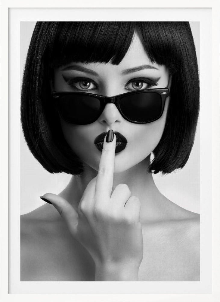 A striking black and white portrait of a woman with a sharp bob haircut, sunglasses, and bold makeup. She holds one finger with a black-painted nail up to her dark lips, making a 'shushing' gesture. Poster
