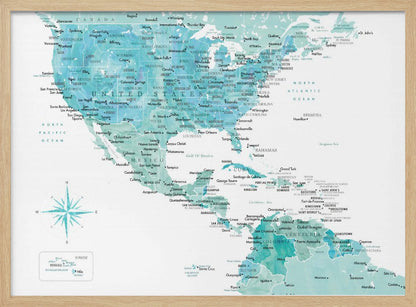 A decorative map of North, Central, and South America in a grey frame. The map has a watercolor texture in shades of blue and teal on a white background, with countries and major cities labeled in a dark font. Print
