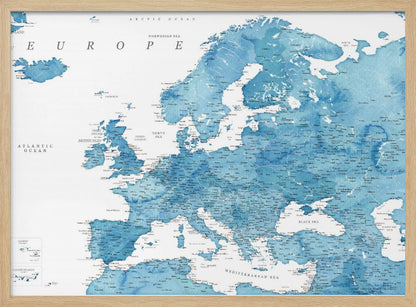 A framed map of Europe with a blue watercolor texture. The land is depicted in various shades of blue, while the oceans are white. Countries, cities, and bodies of water are labeled in black text. The map is housed in a simple, light gray frame. Poster
