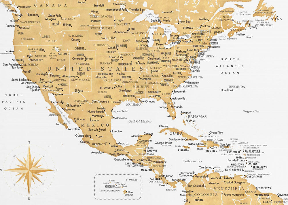 A stylized map of North and Central America and the Caribbean, featuring gold-colored landmasses on a light gray, textured background. Countries, states, and major cities are labeled in black text. A compass rose is shown in the lower-left corner. The entire map is enclosed in a light gray frame. Decor
