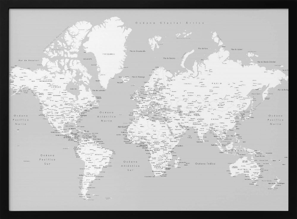 A detailed world map in Spanish with a monochromatic color scheme, framed in a light gray wooden frame. The continents are shown in white on a light gray ocean background, with countries and numerous cities labeled in black text. Artwork