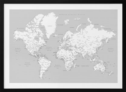 A detailed world map in Spanish with a monochromatic color scheme, framed in a light gray wooden frame. The continents are shown in white on a light gray ocean background, with countries and numerous cities labeled in black text. Artwork