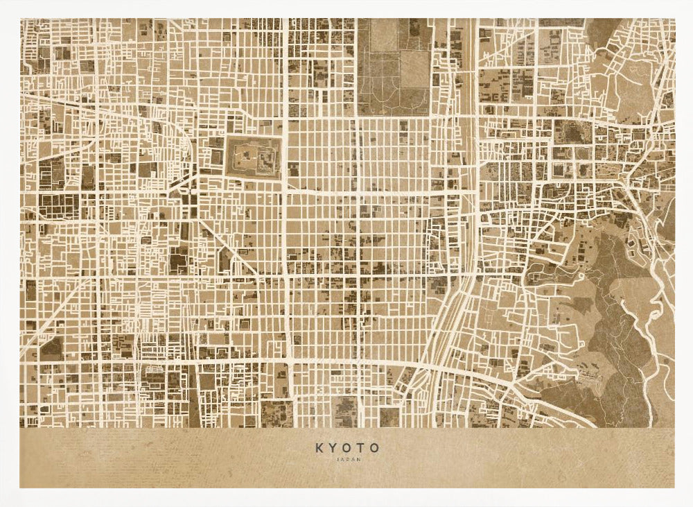 A framed, stylized map of Kyoto, Japan, in shades of brown and beige. The city streets are illustrated as a complex grid of off-white lines against a textured brown background. At the bottom, a solid beige banner contains the text 'KYOTO' and 'JAPAN' in a modern sans-serif font. The artwork is surrounded by a brushed silver frame. Artwork