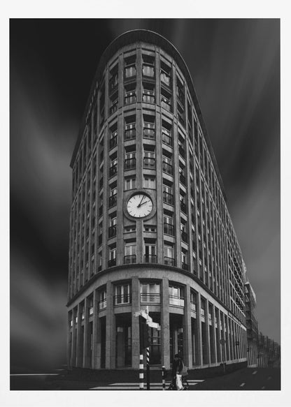 A dramatic low-angle, black and white photograph of a large, curved corner building with a prominent clock on its facade. The sky is dark with a motion blur effect, making the building appear grand and imposing. Artwork