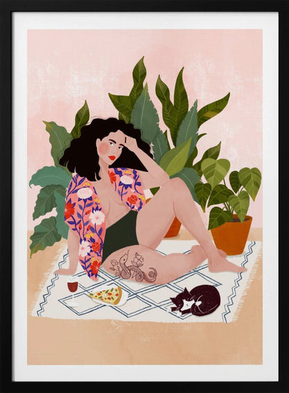 An illustration of a woman with dark curly hair relaxing on a patterned blanket indoors. She is wearing a green swimsuit and a pink floral shirt, with a prominent snake tattoo on her thigh. Next to her is a slice of pizza, a glass of red wine, and a sleeping black and white cat, all set against a backdrop of large green houseplants and a pink wall. Artwork