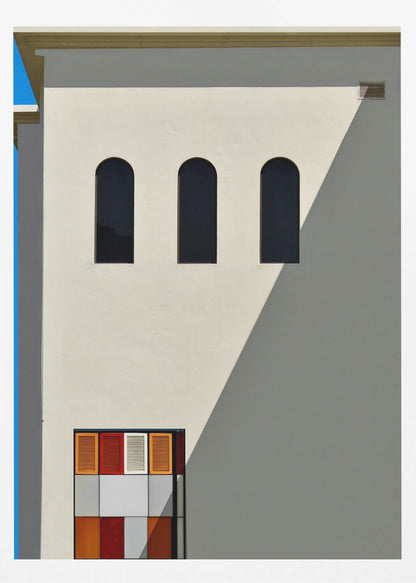 A minimalist photograph of a cream-colored building facade with a sharp diagonal shadow. Three black arched windows are arranged horizontally, and below them, a colorful grid of red, orange, and white panels. A vibrant blue vertical stripe is visible on the far left edge. Wall Art