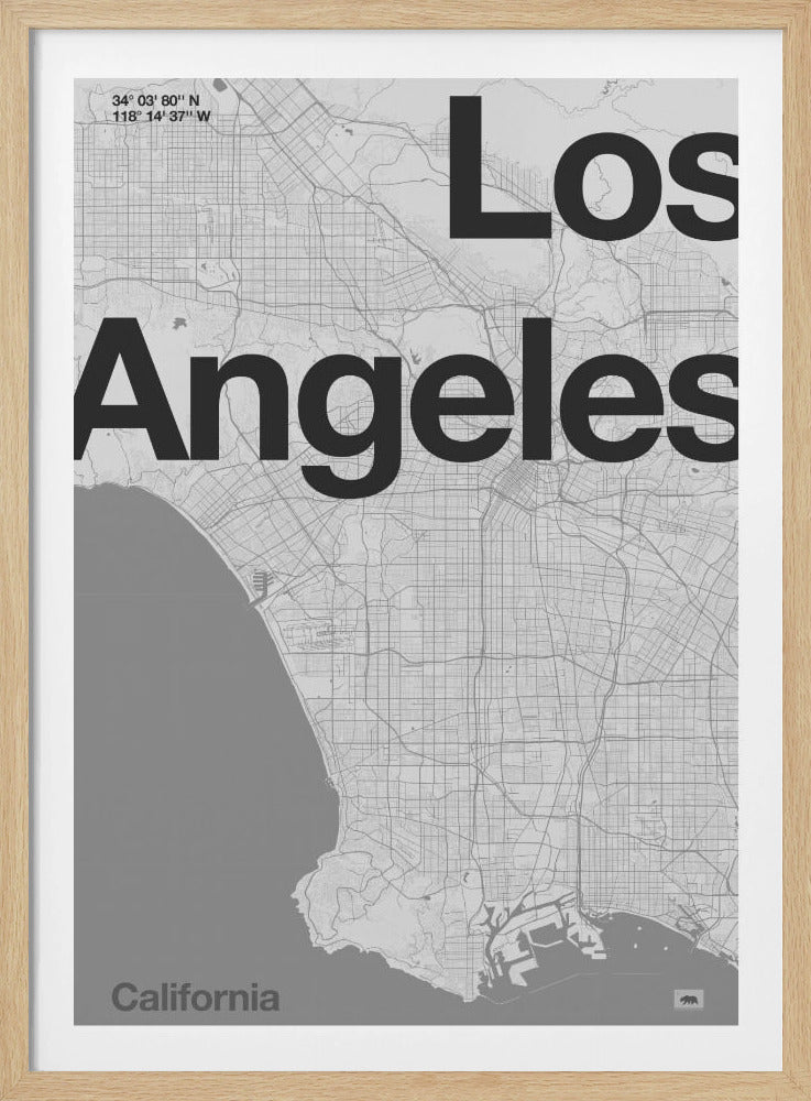 A minimalist black and white framed map of Los Angeles. The poster features a detailed street grid of the city and its coastline. The words 'Los Angeles' are overlaid in a large, bold, black sans-serif font. In the top-left corner are the coordinates, and in the bottom-left is the word 'California'. Decor