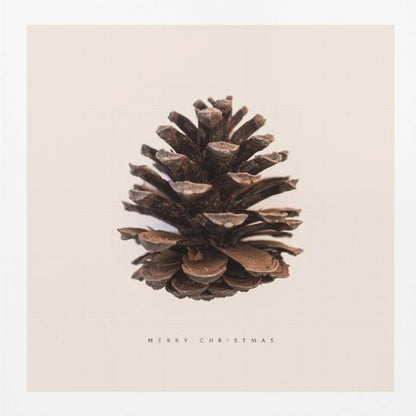 A minimalist art print featuring a single brown pinecone centered on an off-white background. The words 'MERRY CHRISTMAS' are printed in a simple, spaced-out font below the pinecone. The entire image is enclosed in a light wood frame. Artwork
