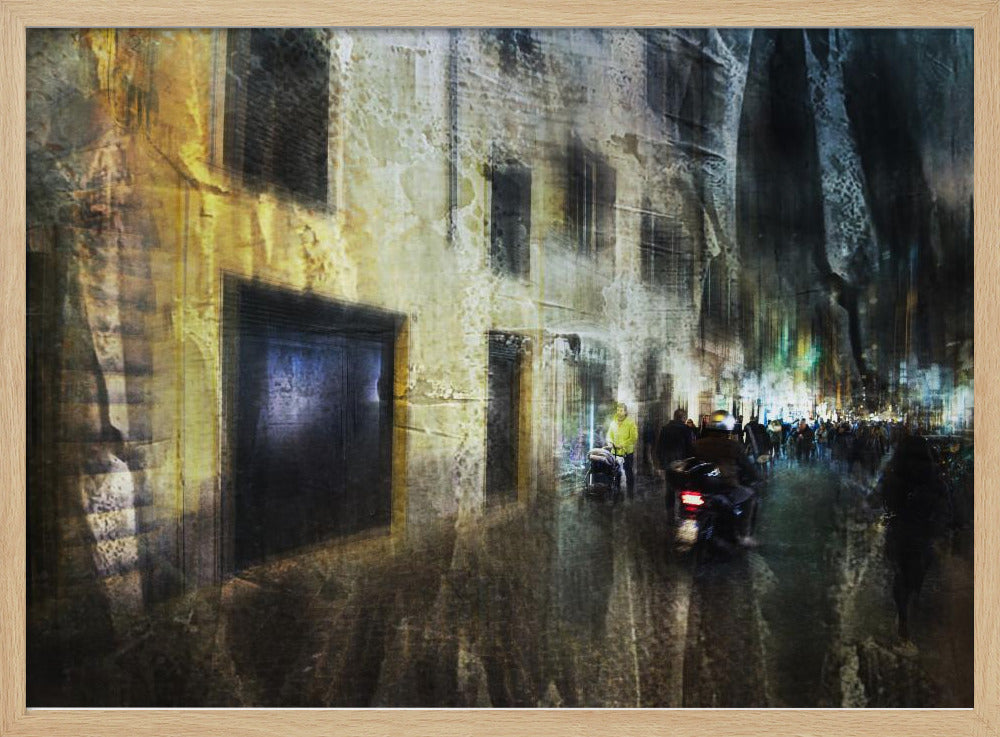 A framed abstract digital artwork depicting a busy, narrow city street at night. The image has a heavily textured, painterly style, with blurred motion effects. A weathered, yellow-lit building is on the left, while the street on the right is filled with indistinct figures of people and a motorcycle, with city lights glowing in the distance. Wall Art
