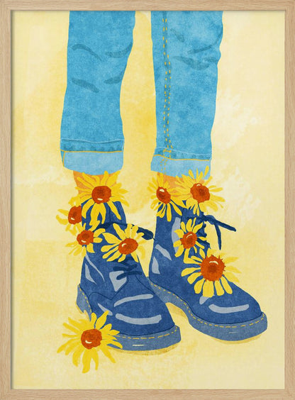 An illustration of a person's lower legs and feet wearing cuffed blue jeans and blue combat boots against a pale yellow background. Bright yellow and orange sunflowers are blooming out of the boots and laces. Poster